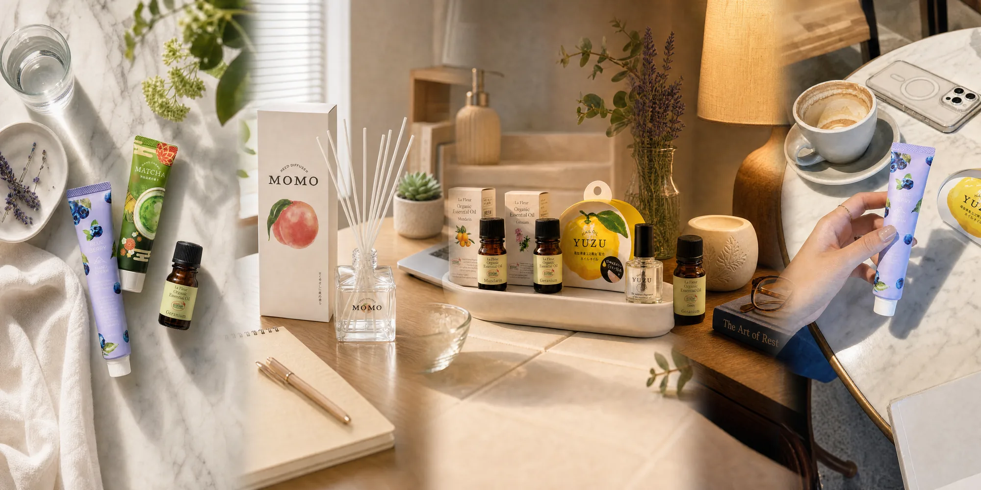 Neoi organic essential oils, MOMO reed diffuser, YUZU nail oil and Japanese hand creams arranged on a sunlit desk